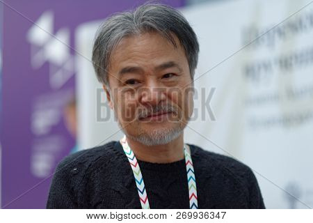 ST. PETERSBURG, RUSSIA - NOVEMBER 17, 2018: Kiyoshi Kurosawa, Japanese film director, scriptwriter, writer, professor talks with press during Saint-Petersburg International Cultural Forum