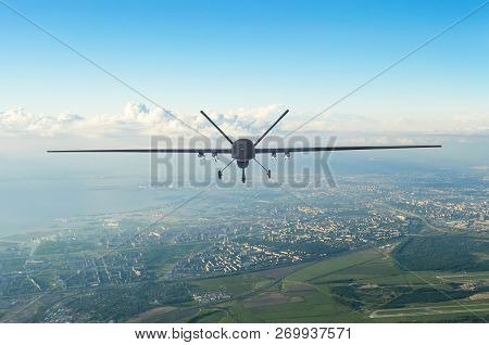 Unmanned Military Drone Uav Flying In The Air Over The City In The Morning.
