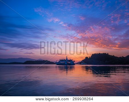 Ferry boat at Sunrise on the bay of Nidri in Lefkas Ionian  island Greece