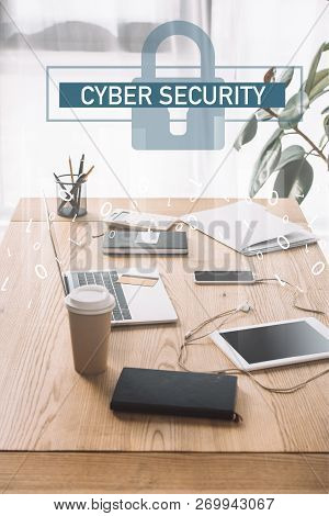 Close Up View Of Cuber Security Sign, Workplace With Laptop, Coffee To Go And Notebook