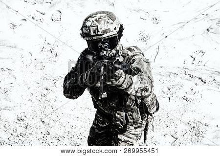 Airsoft War Game Player Shooting With Gun Replica