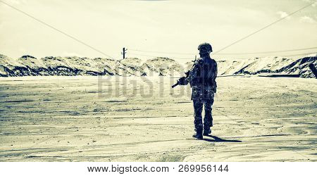 Army Ranger In Combat Patrol In Desert Area