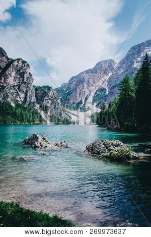 Autumn Time At Romantic Forest Lake Blausee, One Of The Best Known Mountain Lakes In Switzerland.