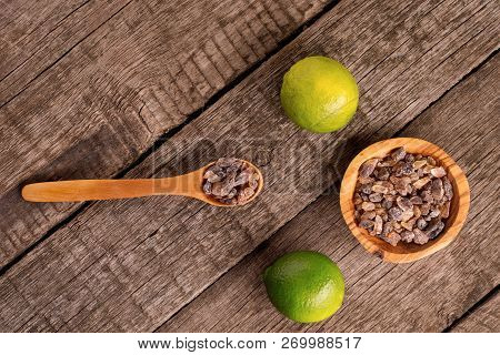 Mojito Ingredients. Lemon And Cane Sugar On Rustic Wooden Background. Sweet Sugar And Lemon.