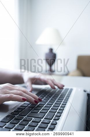 Woman Typing On Laptop Pc