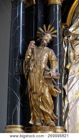 WURZBURG, GERMANY - JULY O4, 2018: Saint Joachim statue on the Virgin Mary altar in the Neumunster Collegiate Church in Wurzburg, Germany