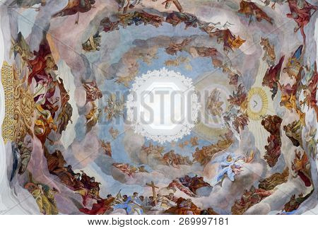 WURZBURG, GERMANY - JULY O4, 2018: Adoration of the Holy Trinity by saints and angels ceiling fresco in Neumunster Collegiate Church in Wurzburg, Germany