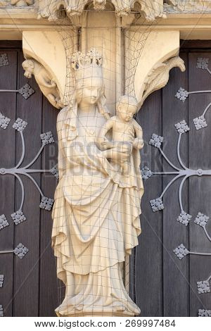 WURZBURG, GERMANY - JULY O4, 2018: Virgin Mary with baby Jesus, main portal of the Marienkapelle in Wurzburg, Bavaria, Germany