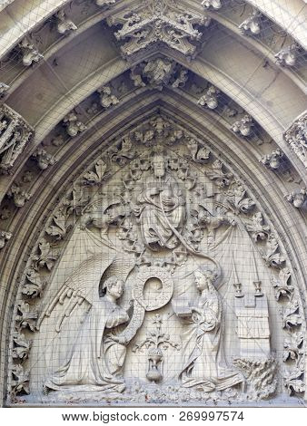 WURZBURG, GERMANY - JULY O4, 2018: The tympanum shows the Annunciation to Mary, portal of the Marienkapelle in Wurzburg, Bavaria, Germany