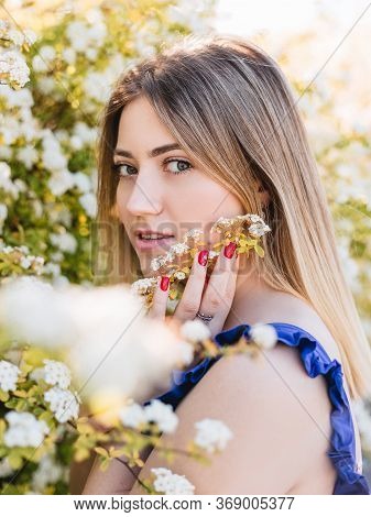 Sensual Calm Portrait Of Beautiful Hipster Woman In Blooming Bush With White Flowers Of Spirea. Copy