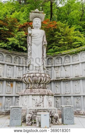 Haeinsa-gil, South Korea; May 26, 2020: Closeup Of Statue Of Standing Buddha Near Haeinsa Temple,