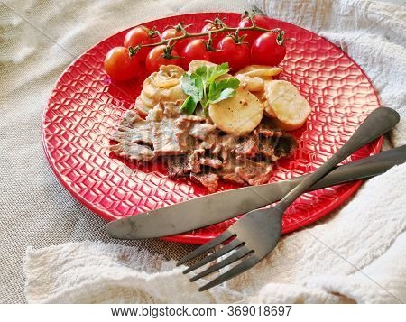 Beef meat stewed with potatoes-Traditional French cuisine Beef Bourguignon potatoes carrots in persillade