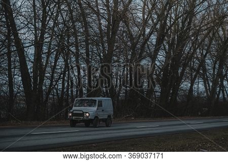 Old Russian Rusty Car In The Forest.