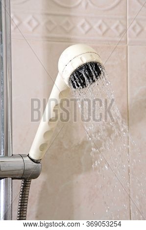 Showerhead In A Tiled Bathroom, Andalusia, Spain.