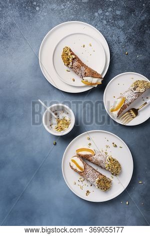 Traditional Italian Dessert Cannoli Siciliani On The Dark Background, Top View Image With A Copy Spa