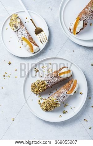 Traditional Italian Dessert Cannoli Siciliani On The Light Background, Top View Image With A Copy Sp