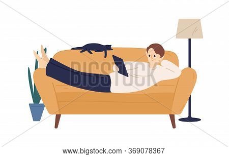 Joyful Domestic Guy Lying On Couch Holding Tablet Pc Vector Flat Illustration. Modern Man Surfing In