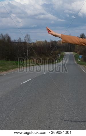 Travel, Travel, Leisure, Passion For Travel. Hitchhiker Sign On The Road. Thumbs Up Female Hand Gest
