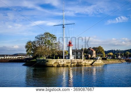 White And Red Lighthouse In Honfleur River La Morelle, France