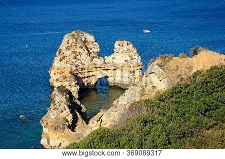 Elevated View Of The Coastline And A Natural Arch In The Ocean, Praia Da Dona Ana, Lagos, Portugal, 