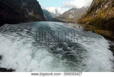 View On Fjord And A Backtrace Of A Boat From The Behind Desk And Mountains Behind, Norway