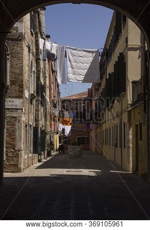 Venice, Italy - May 28 2016: Ancient Road In Venice With Cloths Hang Out To Dry