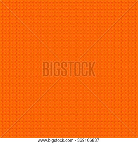 Orange Base Template Of Plastic Construction Brick. Plastic Toy Blocks Background In Orange. Constru
