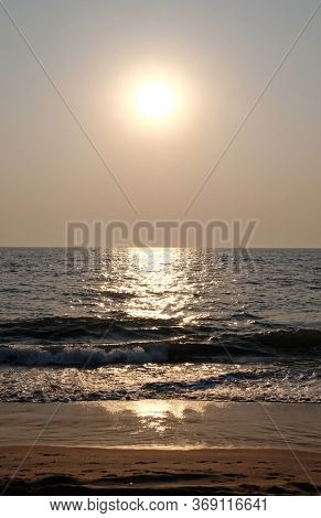 CANDOLIM, INDIA - FEBRUARY 18, 2020: Sunset at Candolim Beach, North Goa, India