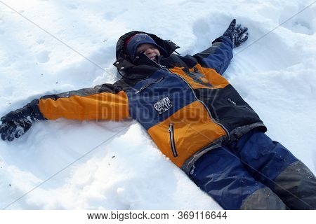 ZAGREB, CROATIA - JANUARY 12, 2014: Children having fun in snow, Park Maksimir in Zagreb, Croatia