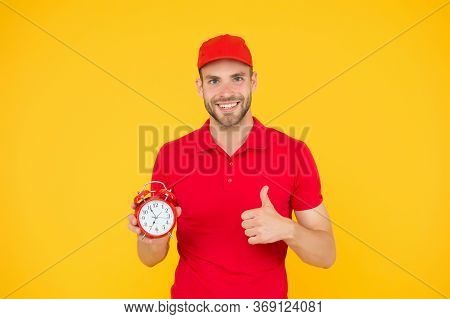 Promptness And Punctuality. Delivery Time. Delivery Courier With Clock. Delivery Man Holding Clock. 