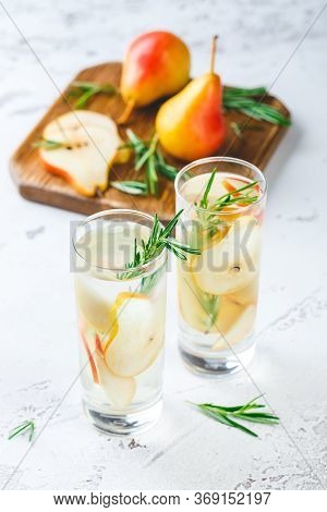 Summer Drinks, Rosemary Pear Cocktails With Ice In Glasses. Refreshing Summer Homemade Alcoholic Or 