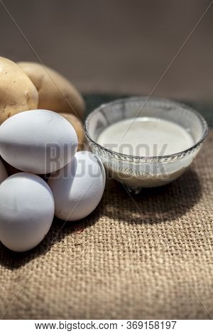 Potato And Egg White Face Mask To Achieve Natural Glowing Skin On A Brown Colored Surface With Raw P