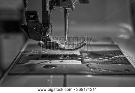 Closeup Of A Domestic Sewing Machine Needle And Thread