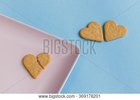 Broken Heart. Cookies Like A Romantic And Dramatic Scene. Heart Shaped Cookies. Pink And Light Blue 