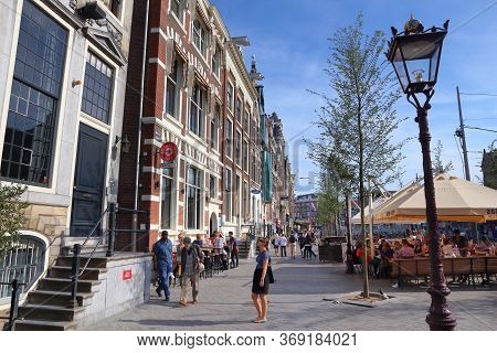 Amsterdam, Netherlands - July 9, 2017: People Visit Oude Turfmarkt In Amsterdam, Netherlands. Amster
