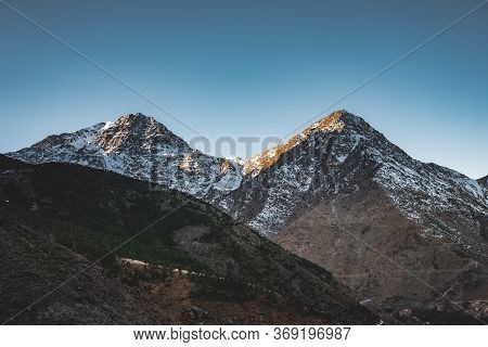 Snow Covered Peaks Of Toubkal National Park Morocco, High Atlas Mountains. Sunrise Light With Blue S
