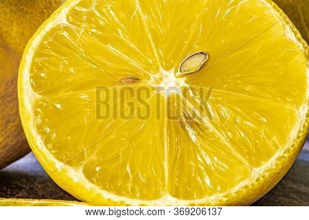 Top View Of Lemon And Green Leaves On Wooden Background