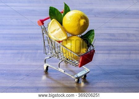Supermarket Cart Carrying Green Leaf And Lemon