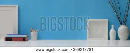 Creative Home Office Desk With Mock-up Frames, Books, Stationery, Ceramic Vases And Copy Space