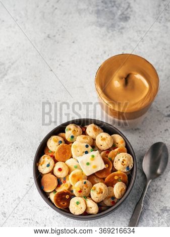 Mini Pancakes Cereal And Dalgona Coffee On Gray Cement Background, Copy Space. Trendy Food And Drink