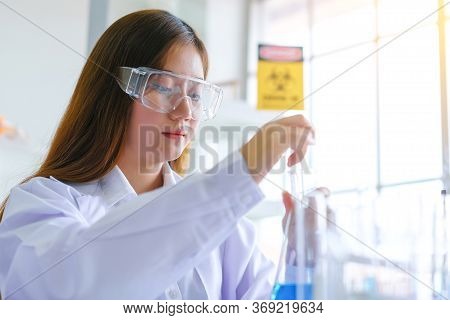 Doctor And Microbiologist With Vacuum Tubes For Samples With Covid 19 Infection Atypical Pneumonia V