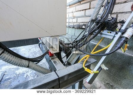 Russia, Saint-petersburg - April 30, 2018: Cables Are Near Of Climatic Vandal-proof Cabinet With Mic
