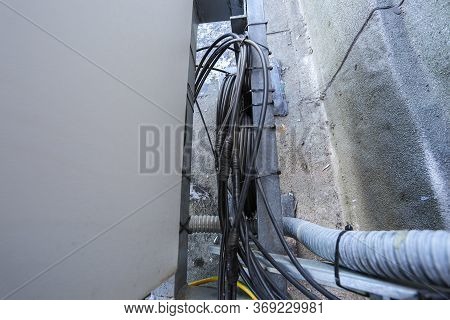 Russia, Saint-petersburg - April 30, 2018: Cables Are Near Of Climatic Vandal-proof Cabinet With Mic