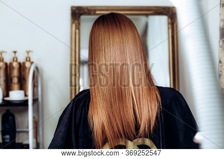 Back View Of Redhead Girl With Long And Straight Brown Hair . Shiny Smooth Hair. Copypast