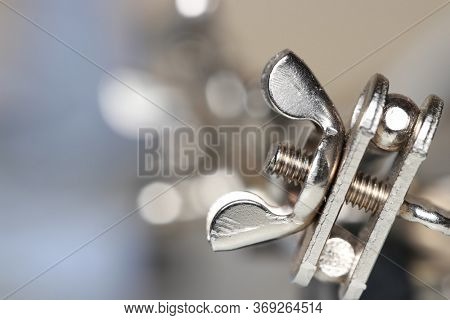Shiny metal wing nut close up shot