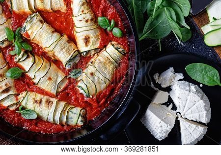 Italian Zucchini Rolls With Cream Cheese Filling Mixed With Baby Spinach, Fresh Basil Leave Baked In