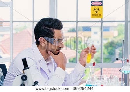 Doctor And Microbiologist With Vacuum Tubes For Samples With Covid 19 Infection Atypical Pneumonia V