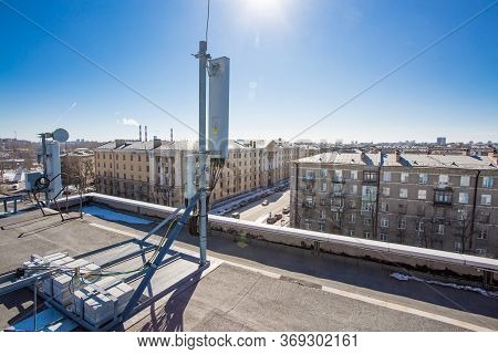 Russia, Saint-petersburg - April 30, 2018: Panel Antenna Of 5g, 4g, 3g, 2g Bands, Optical Fibers, Po