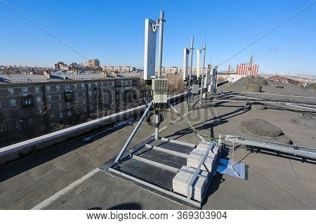 Russia, Saint-petersburg - April 30, 2018: Panel Antenna Of 5g, 4g, 3g, 2g Bands, Optical Fibers, Po