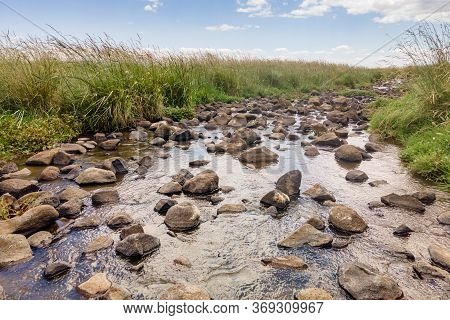 Shallow River Daliyot Flowing Near The Remnants Of The Early Bronze Age Megalithic Complex Of The Ea